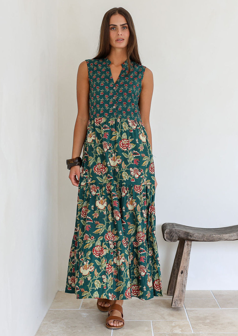 Model wearing the Wild Garland green floral cotton tiered maxi dress.